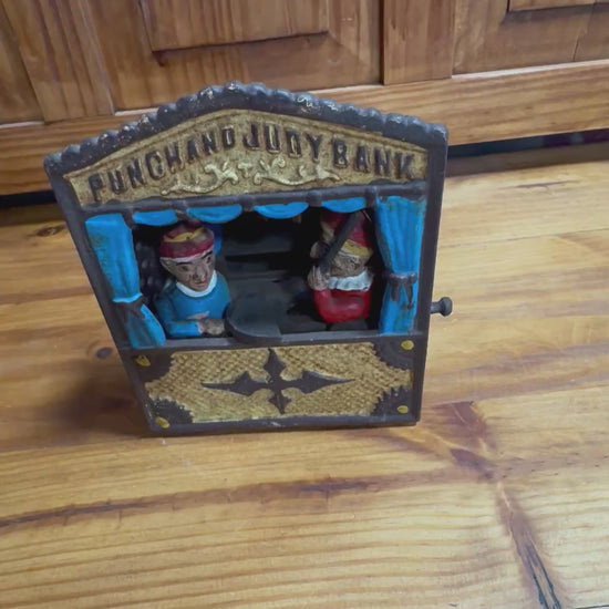 Vintage Punch and Judy mechanical cast iron bank made in Taiwan.
