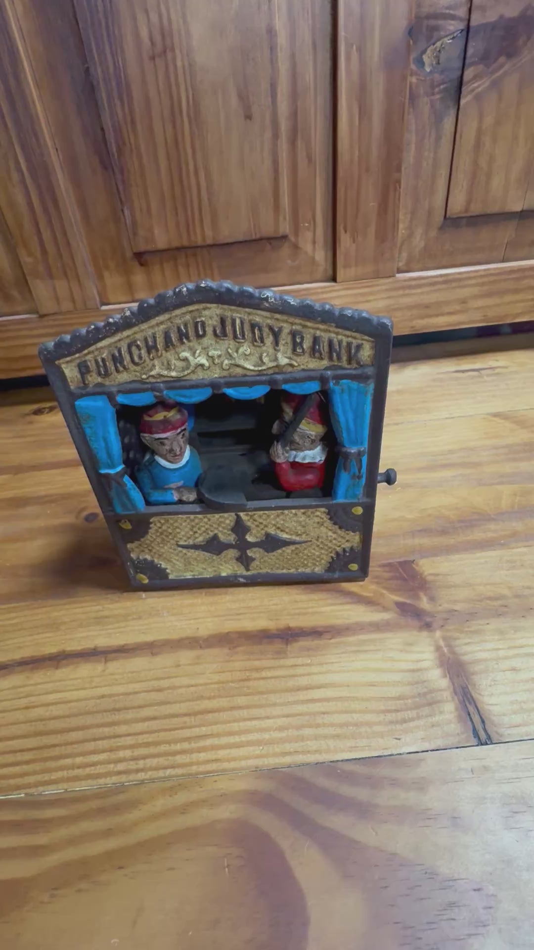 Vintage Punch and Judy mechanical cast iron bank made in Taiwan.